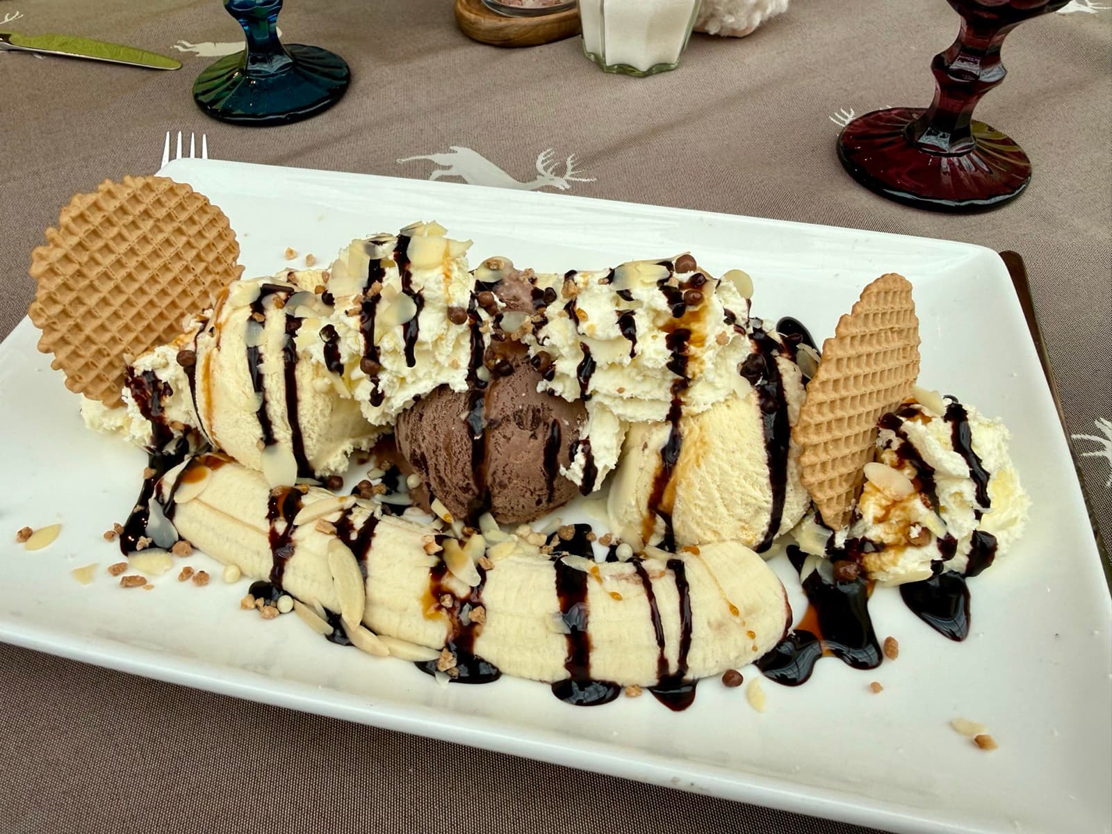Banana split sundae with ice cream, whipped cream and chocolate sauce at Zentrum Café Restaurant