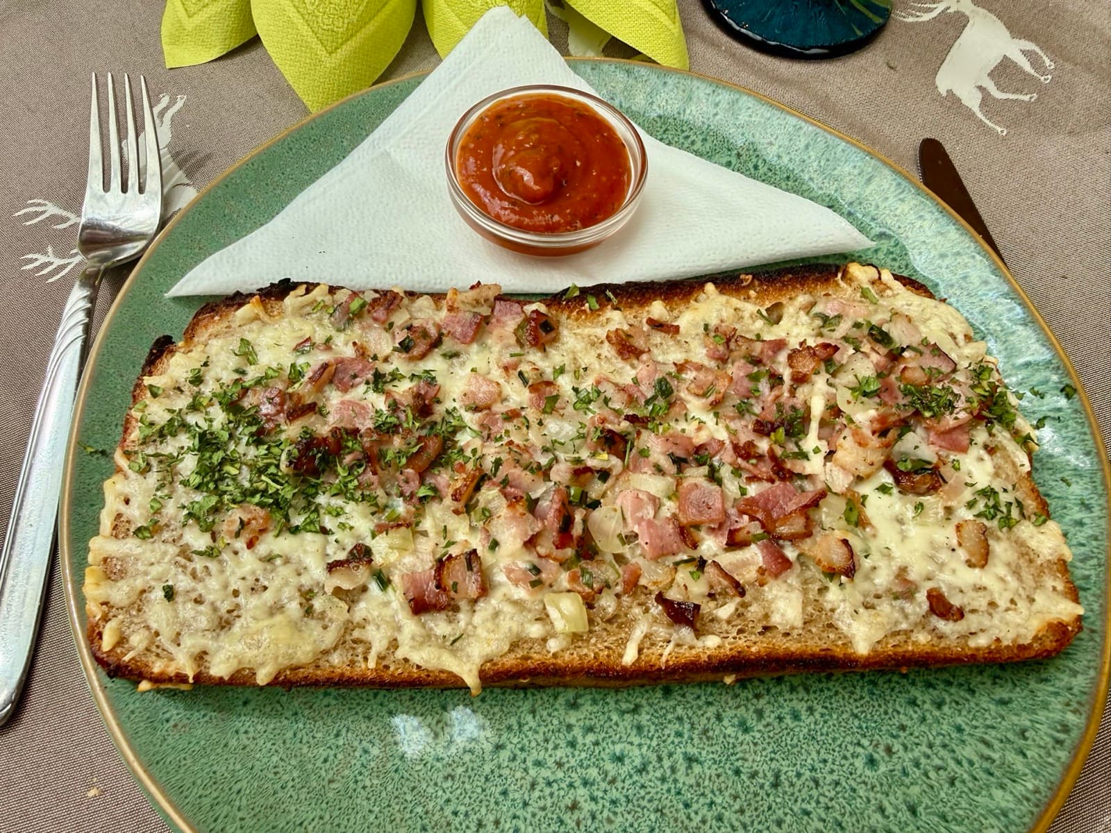 Hearty Holzfällerbrot — rustic open bread topped with savoury garnish at Zentrum Café Restaurant